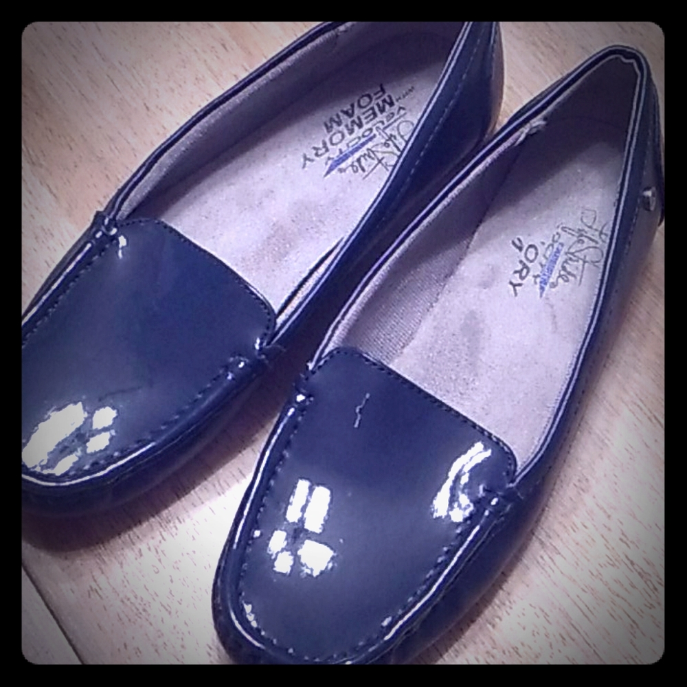 Navy patent and leather slip ons.